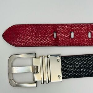 Reversible hot pink/black faux snakeskin belt with chrome buckle